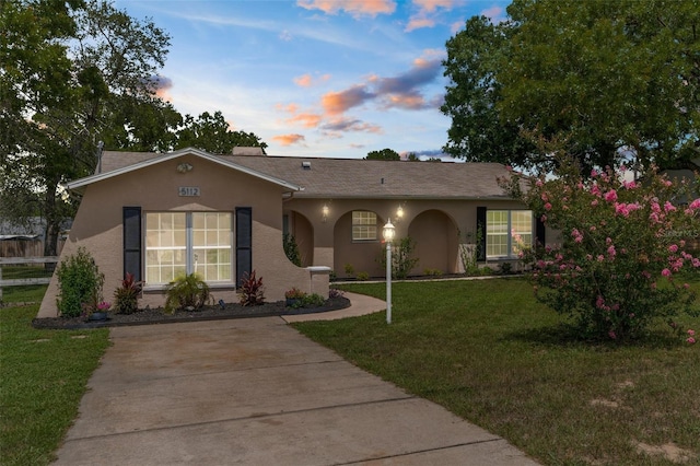 5112 Odin St, Spring Hill, FL 34608 - ranch-style home with stucco siding and a yard