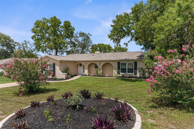5112 Odin St, Spring Hill, FL 34608 - single story home with stucco siding, a front lawn, and a garage