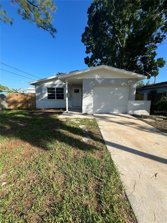 1782 Michigan Ave NE, Saint Petersburg, FL 33703 - ranch-style home with an attached garage and concrete driveway