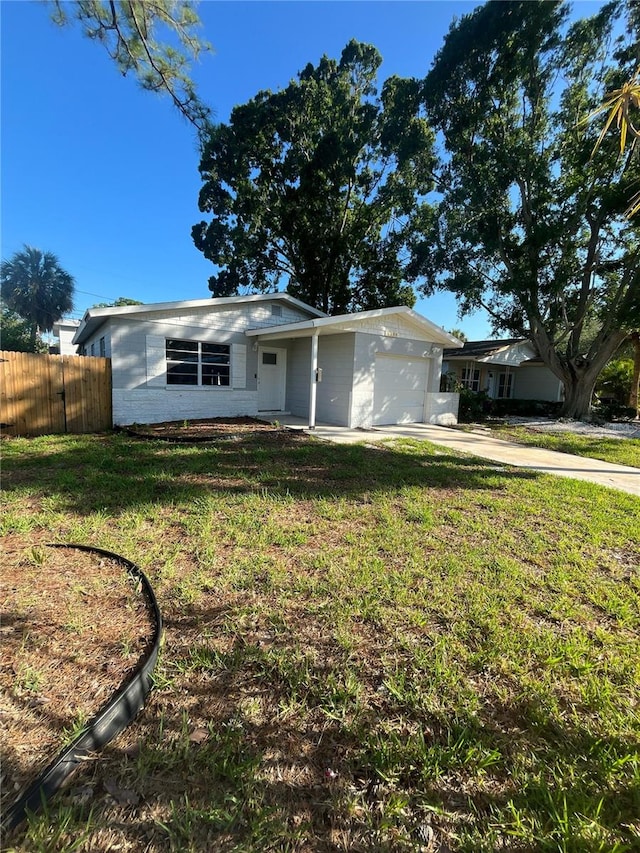 1782 Michigan Ave NE, Saint Petersburg, FL 33703 - ranch-style house featuring an attached garage and driveway