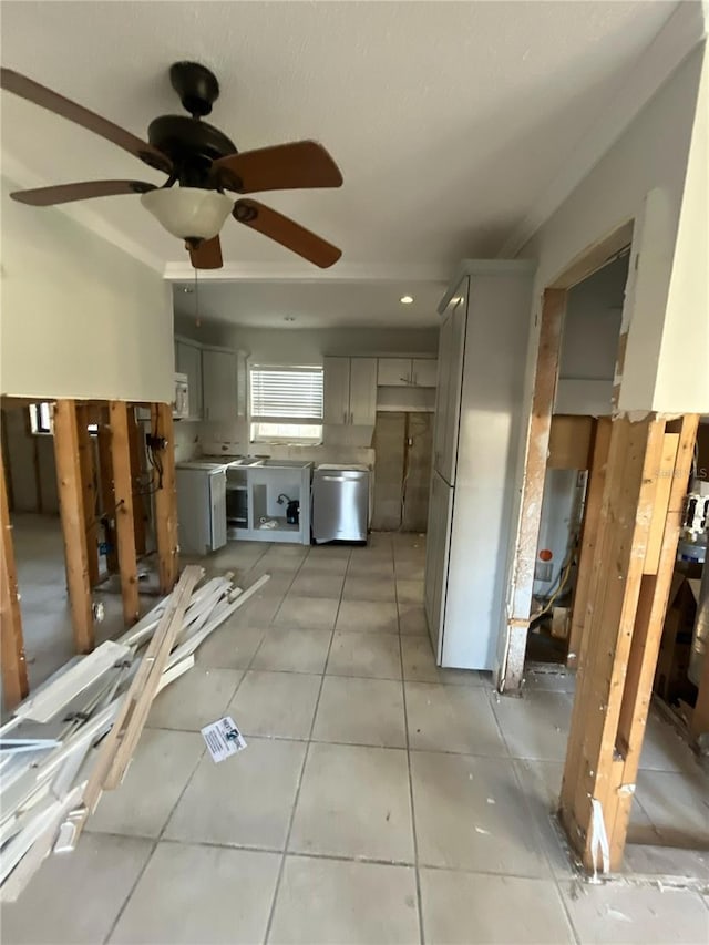 1782 Michigan Ave NE, Saint Petersburg, FL 33703 - kitchen with gray cabinets, stainless steel dishwasher, light tile patterned flooring, ceiling fan, and white microwave