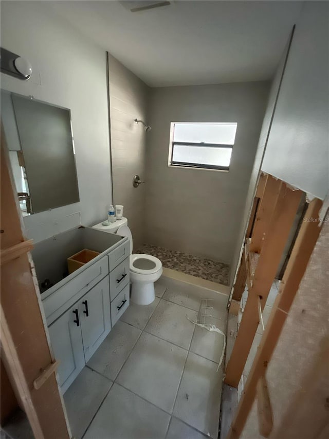 1782 Michigan Ave NE, Saint Petersburg, FL 33703 - bathroom featuring a stall shower, vanity, and tile patterned flooring