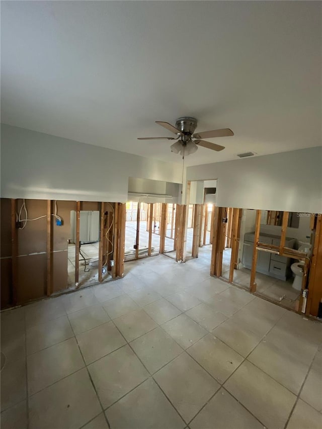 1782 Michigan Ave NE, Saint Petersburg, FL 33703 - unfurnished living room with ceiling fan and tile patterned floors