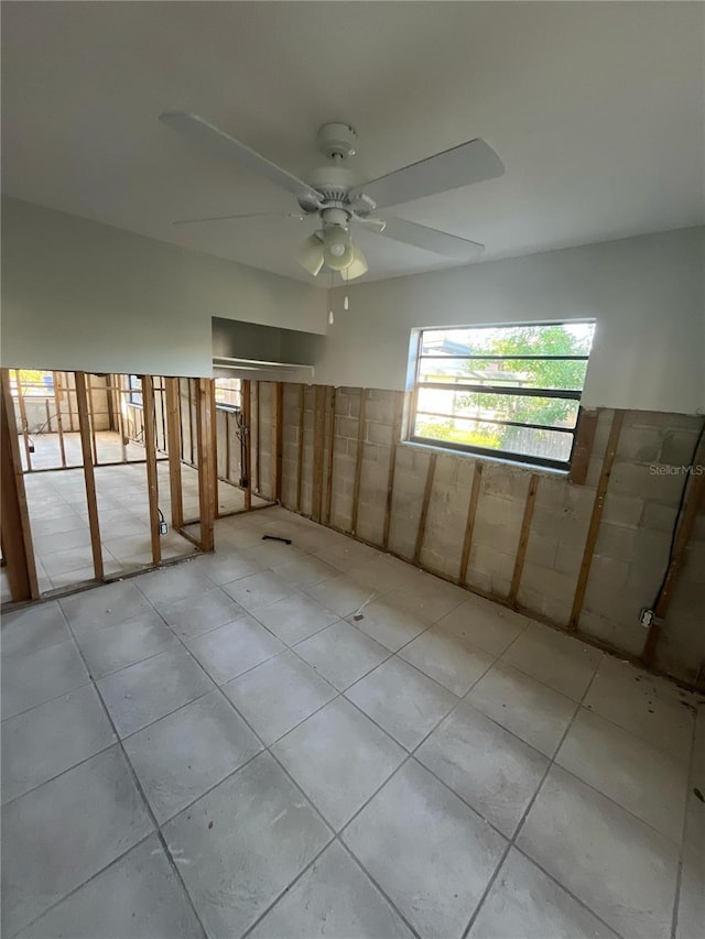 1782 Michigan Ave NE, Saint Petersburg, FL 33703 - spare room featuring tile patterned flooring and a ceiling fan