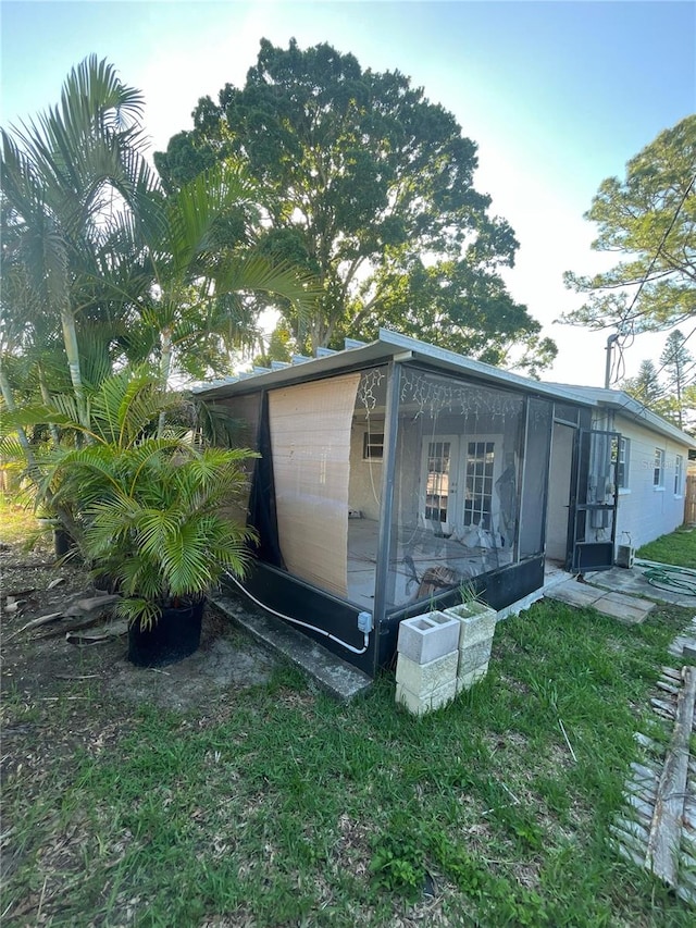 1782 Michigan Ave NE, Saint Petersburg, FL 33703 - view of outbuilding with a sunroom