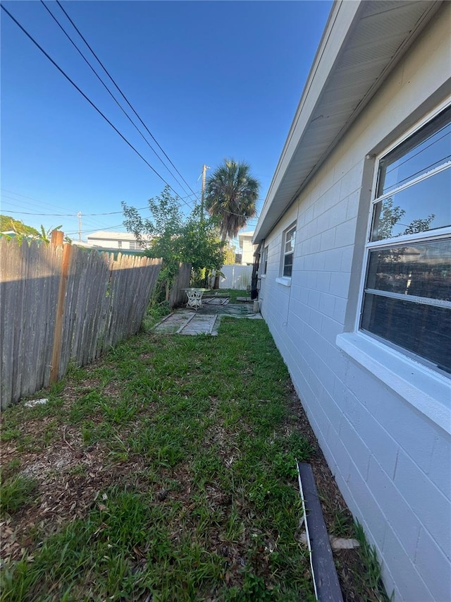 1782 Michigan Ave NE, Saint Petersburg, FL 33703 - fenced backyard with a patio area