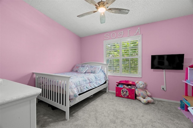 3323 Fox Hunt Dr, Palm Harbor, FL 34683 - bedroom featuring a textured ceiling, carpet flooring, and ceiling fan