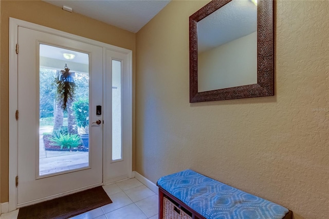163 Brent Cir, Oldsmar, FL 34677 - entryway featuring light tile patterned flooring and a textured wall