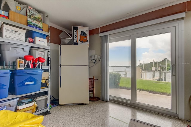 163 Brent Cir, Oldsmar, FL 34677 - kitchen with freestanding refrigerator and speckled floor