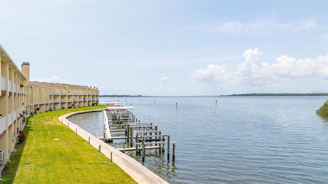 163 Brent Cir, Oldsmar, FL 34677 - dock with a water view and a lawn