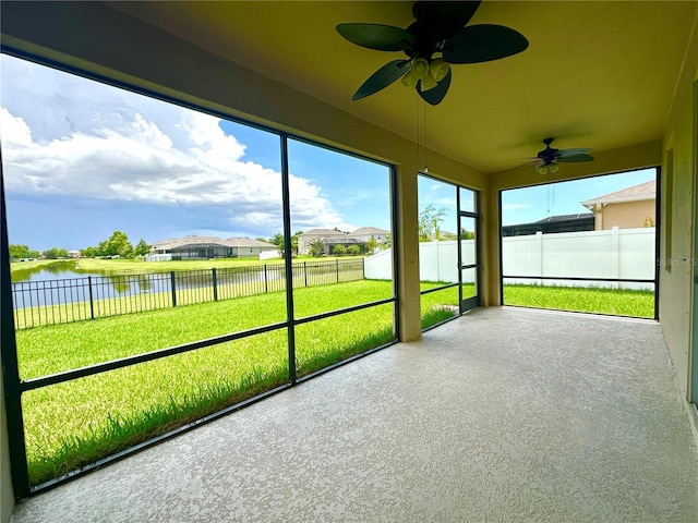 10621 Scenic Hollow Dr, Riverview, FL 33578 - unfurnished sunroom featuring a water view, a ceiling fan, and a residential view