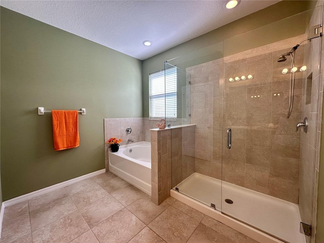 10621 Scenic Hollow Dr, Riverview, FL 33578 - full bath featuring a bath, a shower stall, a textured ceiling, and tile patterned floors