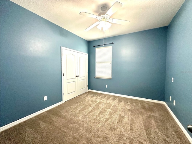 10621 Scenic Hollow Dr, Riverview, FL 33578 - carpeted empty room with a ceiling fan and a textured ceiling