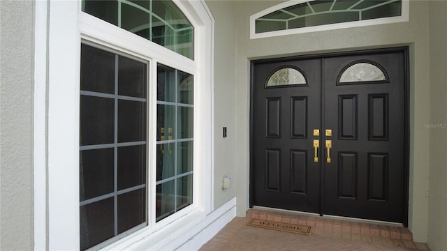 25435 Bruford Blvd, Land O Lakes, FL 34639 - view of exterior entry featuring stucco siding
