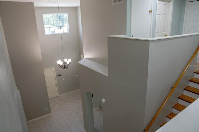 25435 Bruford Blvd, Land O Lakes, FL 34639 - stairs with a chandelier and baseboards