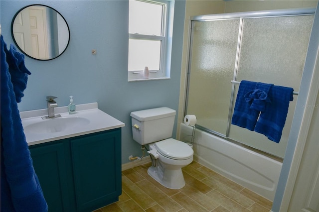 25435 Bruford Blvd, Land O Lakes, FL 34639 - bathroom featuring vanity, combined bath / shower with glass door, and wood finished floors