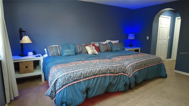 25435 Bruford Blvd, Land O Lakes, FL 34639 - carpeted bedroom with arched walkways and baseboards