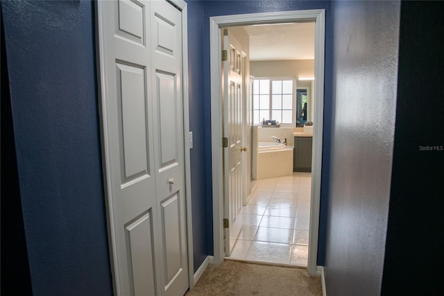 25435 Bruford Blvd, Land O Lakes, FL 34639 - corridor featuring light tile patterned floors and light colored carpet