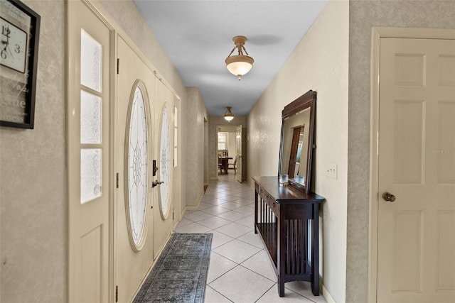 1310 Rustlewood Dr, Brandon, FL 33510 - foyer with light tile patterned floors and baseboards