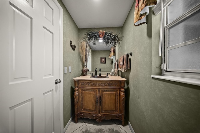 1310 Rustlewood Dr, Brandon, FL 33510 - bathroom with tile patterned flooring, vanity, and a textured wall