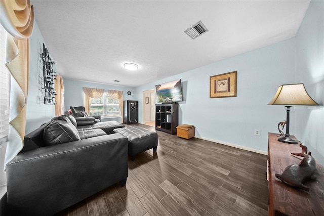 1310 Rustlewood Dr, Brandon, FL 33510 - living area with dark wood-style floors and baseboards
