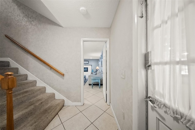 1310 Rustlewood Dr, Brandon, FL 33510 - staircase featuring tile patterned floors and baseboards