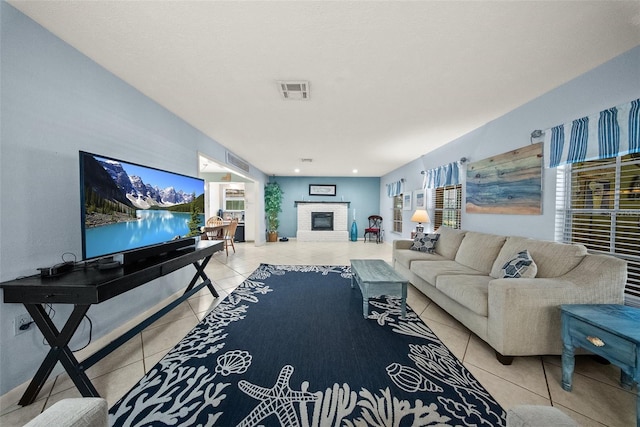 1310 Rustlewood Dr, Brandon, FL 33510 - living area featuring light tile patterned flooring and a brick fireplace