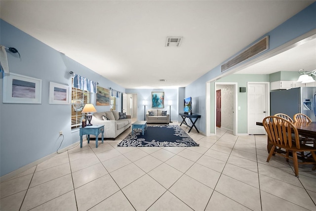 1310 Rustlewood Dr, Brandon, FL 33510 - living area featuring light tile patterned floors and baseboards