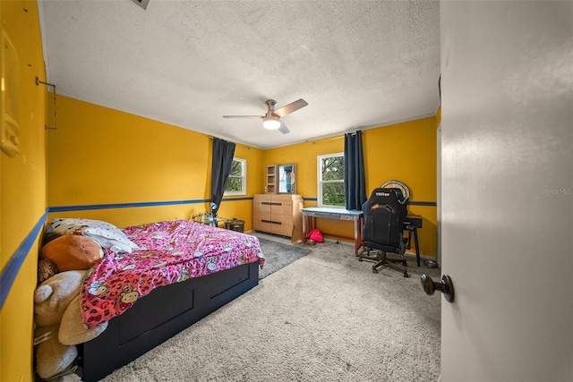 1310 Rustlewood Dr, Brandon, FL 33510 - bedroom featuring carpet floors, a textured ceiling, and a ceiling fan