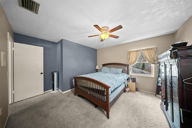 1310 Rustlewood Dr, Brandon, FL 33510 - carpeted bedroom with ceiling fan and a textured ceiling