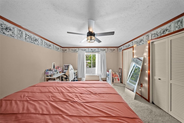 1310 Rustlewood Dr, Brandon, FL 33510 - bedroom featuring ornamental molding, multiple closets, light carpet, a textured ceiling, and wallpapered walls