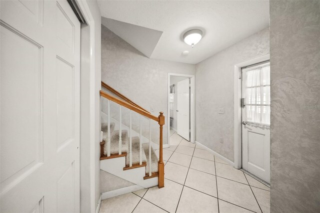 1310 Rustlewood Dr, Brandon, FL 33510 - entryway with light tile patterned flooring and stairway