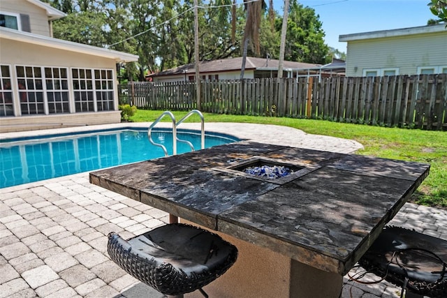 1310 Rustlewood Dr, Brandon, FL 33510 - view of pool with an outdoor fire pit, a patio, and a fenced backyard