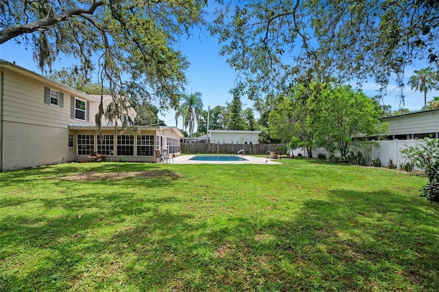 1310 Rustlewood Dr, Brandon, FL 33510 - fenced backyard with a sunroom