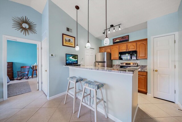 10764 70th Ave Unit 4305, Seminole, FL 33772 - kitchen with black microwave, freestanding refrigerator, white range with electric cooktop, a kitchen bar, and high vaulted ceiling
