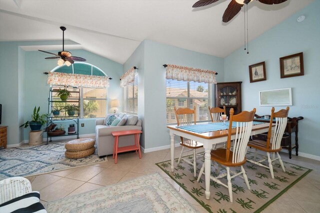 10764 70th Ave Unit 4305, Seminole, FL 33772 - dining room featuring ceiling fan, lofted ceiling, healthy amount of natural light, and light tile patterned flooring