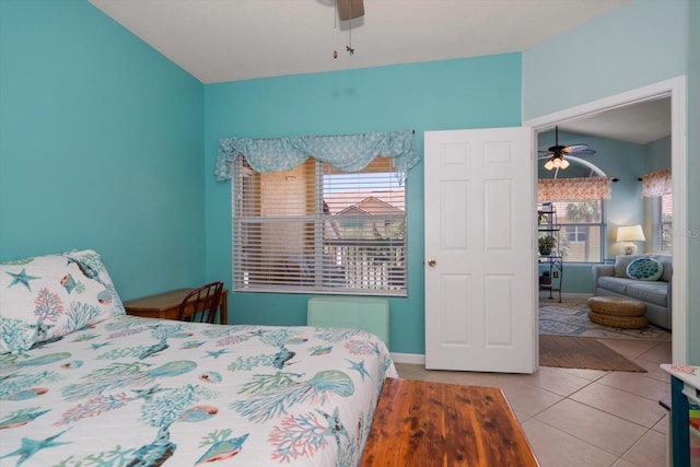 10764 70th Ave Unit 4305, Seminole, FL 33772 - tiled bedroom with a ceiling fan and baseboards