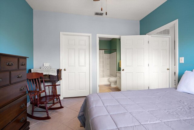 10764 70th Ave Unit 4305, Seminole, FL 33772 - bedroom with tile patterned flooring and ensuite bath