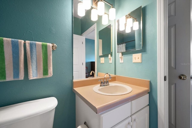 10764 70th Ave Unit 4305, Seminole, FL 33772 - bathroom featuring a textured wall and vanity