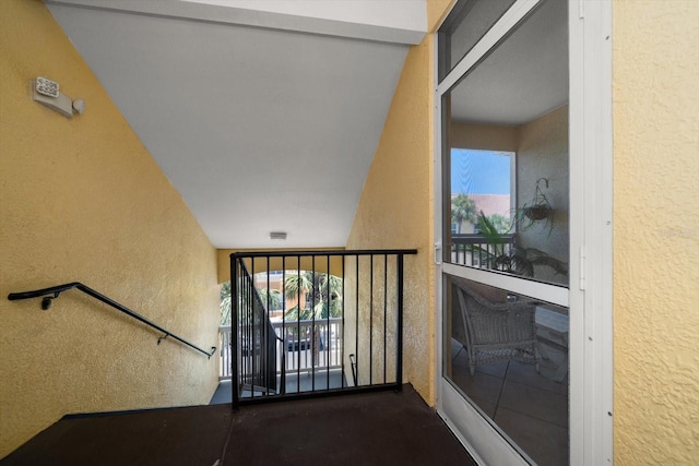 10764 70th Ave Unit 4305, Seminole, FL 33772 - stairs featuring a textured wall and plenty of natural light