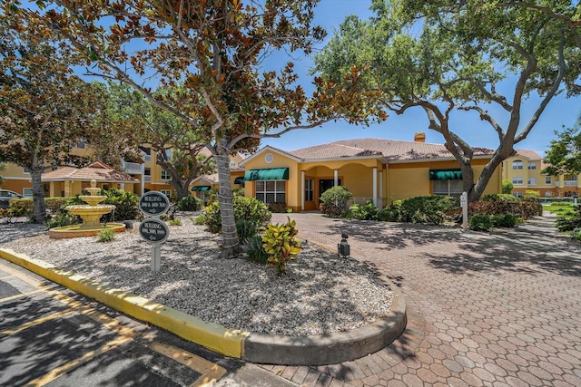 10764 70th Ave Unit 4305, Seminole, FL 33772 - view of front of property with a chimney and stucco siding