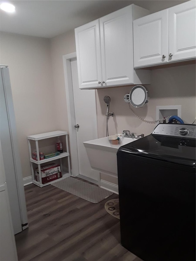 702 Cypress Pl, Sun City Center, FL 33573 - laundry room with washer / dryer, cabinet space, and dark wood-style floors