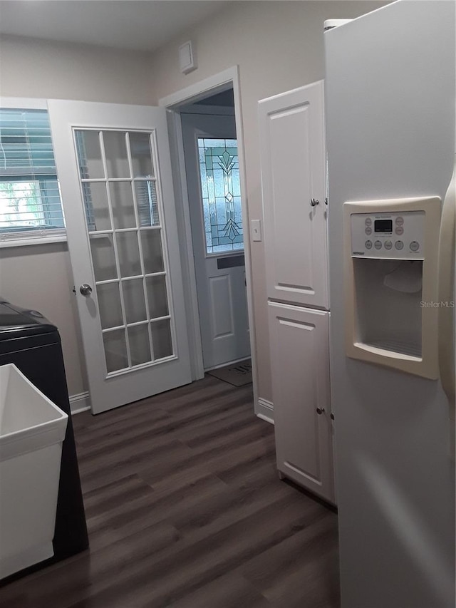 702 Cypress Pl, Sun City Center, FL 33573 - doorway with dark wood finished floors and baseboards