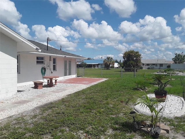 702 Cypress Pl, Sun City Center, FL 33573 - view of yard with a patio and french doors