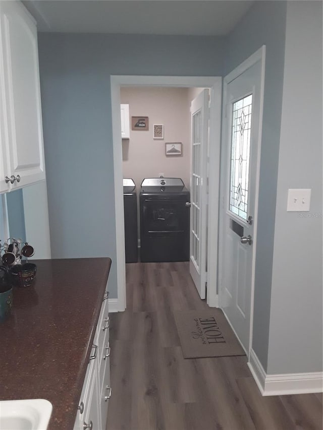 702 Cypress Pl, Sun City Center, FL 33573 - interior space with independent washer and dryer and dark wood-style flooring