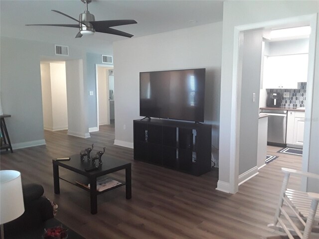 702 Cypress Pl, Sun City Center, FL 33573 - living area featuring a ceiling fan and wood finished floors