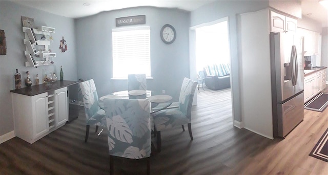 702 Cypress Pl, Sun City Center, FL 33573 - dining area with wood finished floors and baseboards