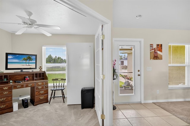 125 Paddock St, Lehigh Acres, FL 33974 - entryway with light carpet, a ceiling fan, and light tile patterned floors