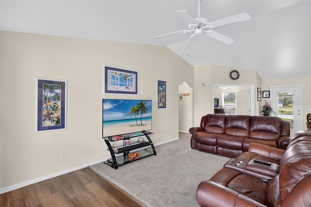 125 Paddock St, Lehigh Acres, FL 33974 - living room featuring arched walkways, lofted ceiling, a ceiling fan, and wood finished floors