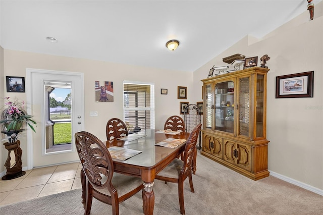 125 Paddock St, Lehigh Acres, FL 33974 - dining area with baseboards and vaulted ceiling